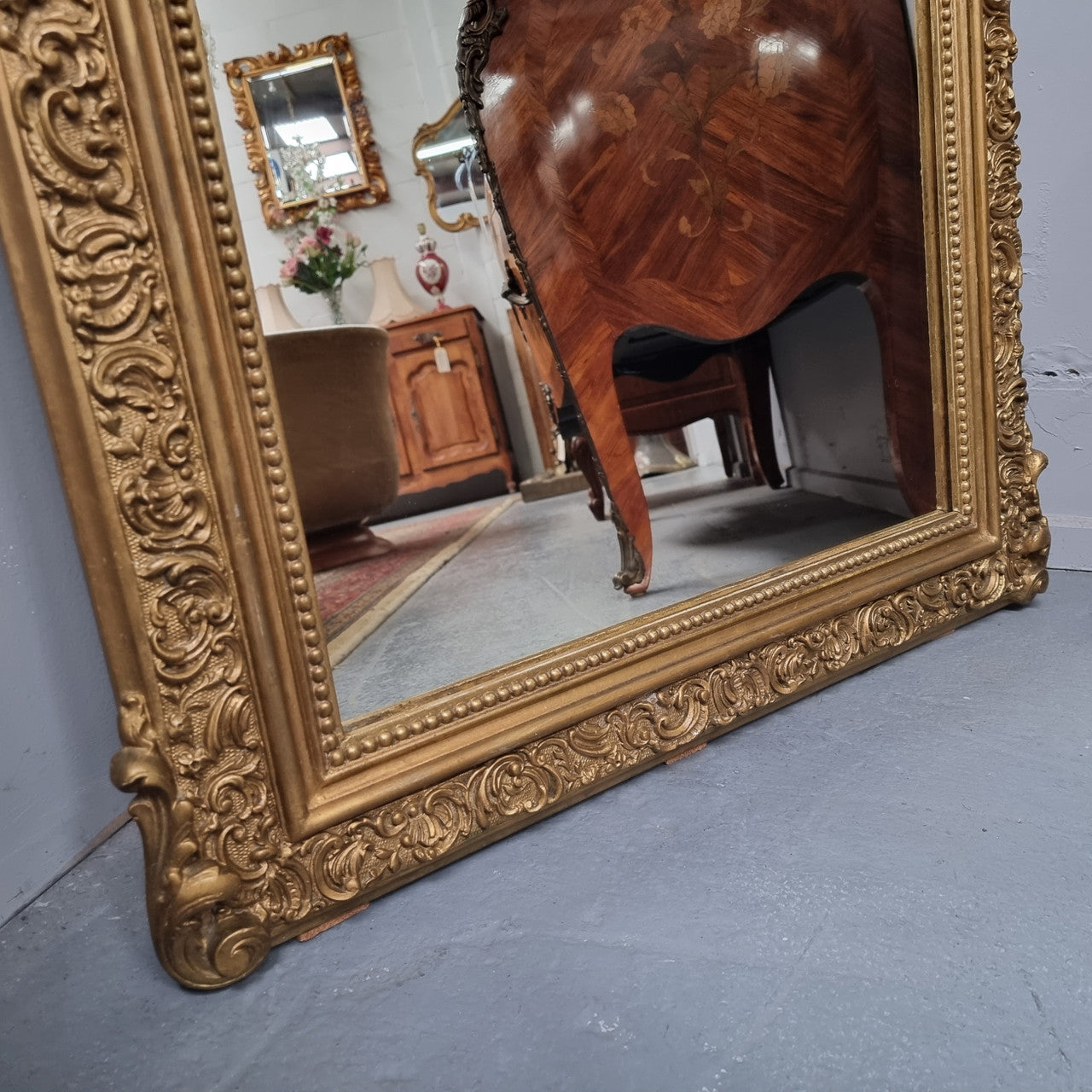 Late 19th Century French Louis XV style carved gilt wall mirror. Sourced from France and in good original detailed condition.