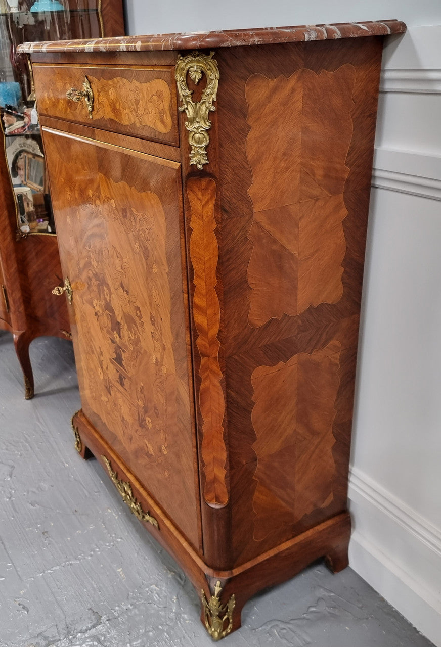 Elegant French transitional style Walnut & Kingwood Salon cabinet. It has beautiful marquetry inlay, a marble top and decorative ormolu mounts. Sourced From France and is in good original detailed condition.