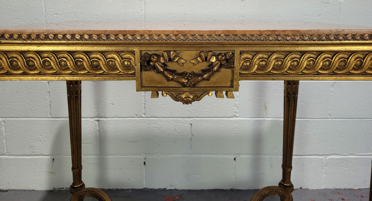 Antique French Louis XVI style gilt center table with a stunning marble top. Featuring stunning ornate carving and it is in great original condition