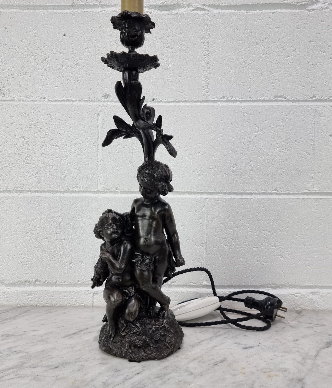 Antique French bronzed metal lamp with cherub's. in very good working original detailed condition.
