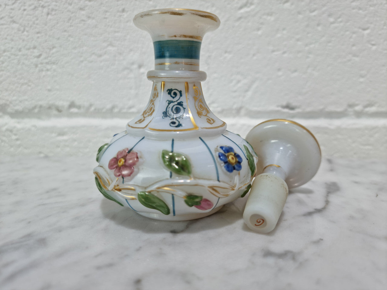 19th century French hand painted and gilded opaline glass scent/perfume bottle. It has marks to the base. In good original condition please view photos as they help form part of the description.