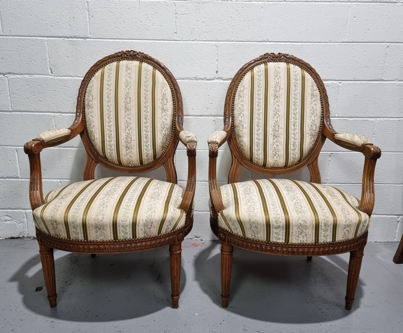 Pair of French Louis XV matching carved armchairs. They are in good overall condition with some slight wear to fabric, please view photos as they help form part of the description.