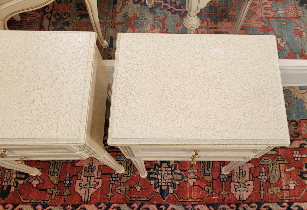 Pair of Vintage Louis 16th style painted crackle finish two drawer French style bedsides. They have elegant reeded legs and have been sourced from France. They are in good original condition.