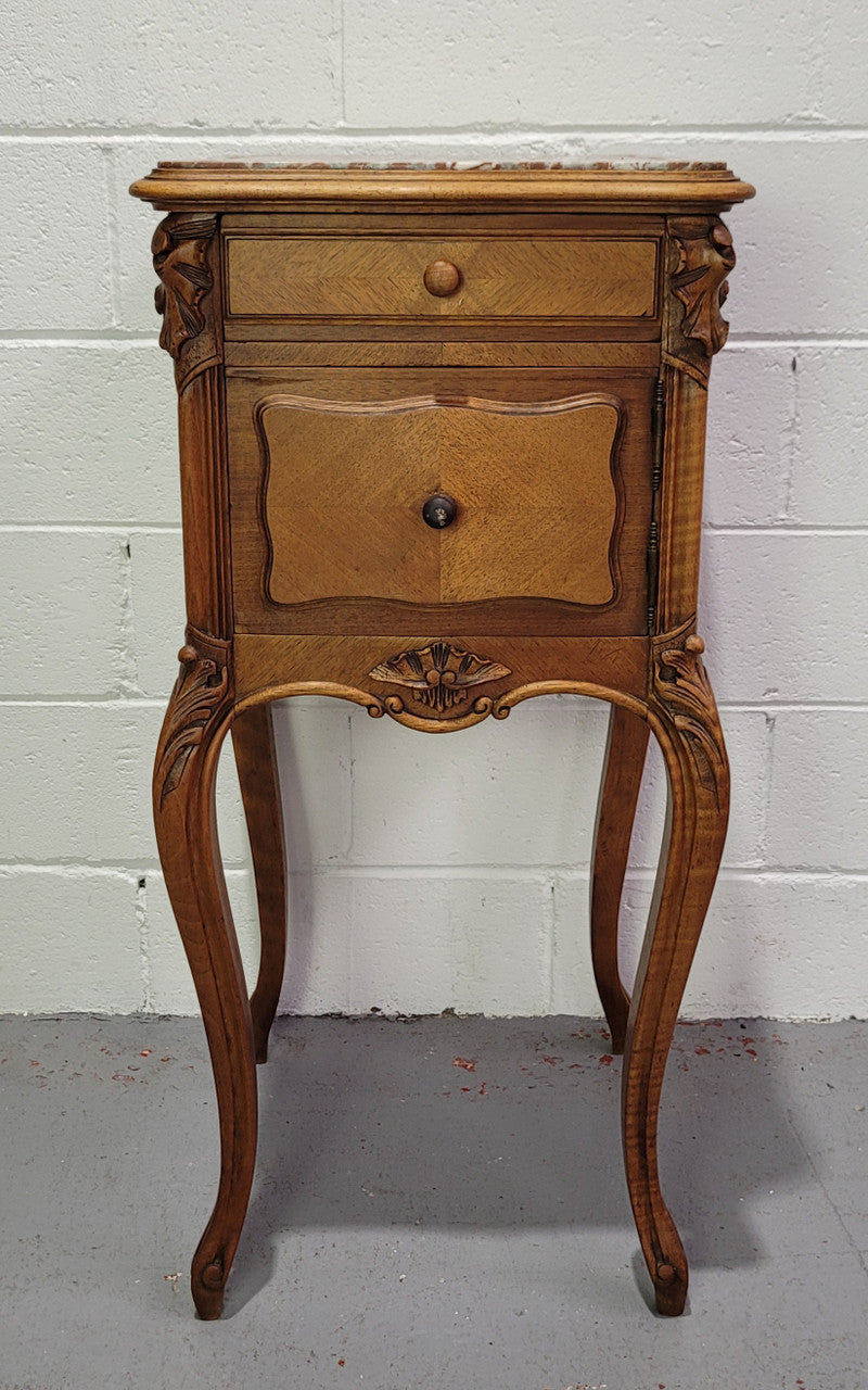 Single French Louis XV style Walnut inset marble top bedside. It has one drawer and one cupboard. It is in good original detailed condition.