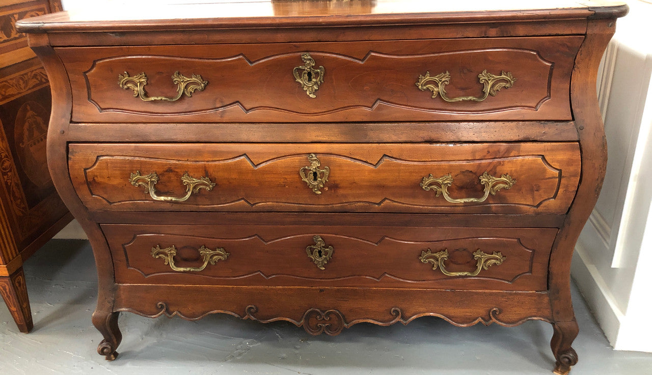 Beautiful 18th Century French all Cherrywood three drawer commode with beautiful ormolu mounts and handles. It is in good original detailed condition.