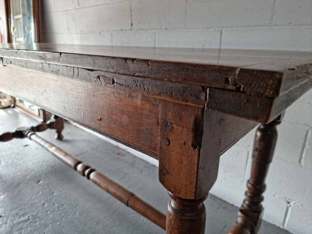 Appealing and rare French Oak Farmhouse extension table. Charming character to the top and comfortably seats 12 people. In good original detailed condition.