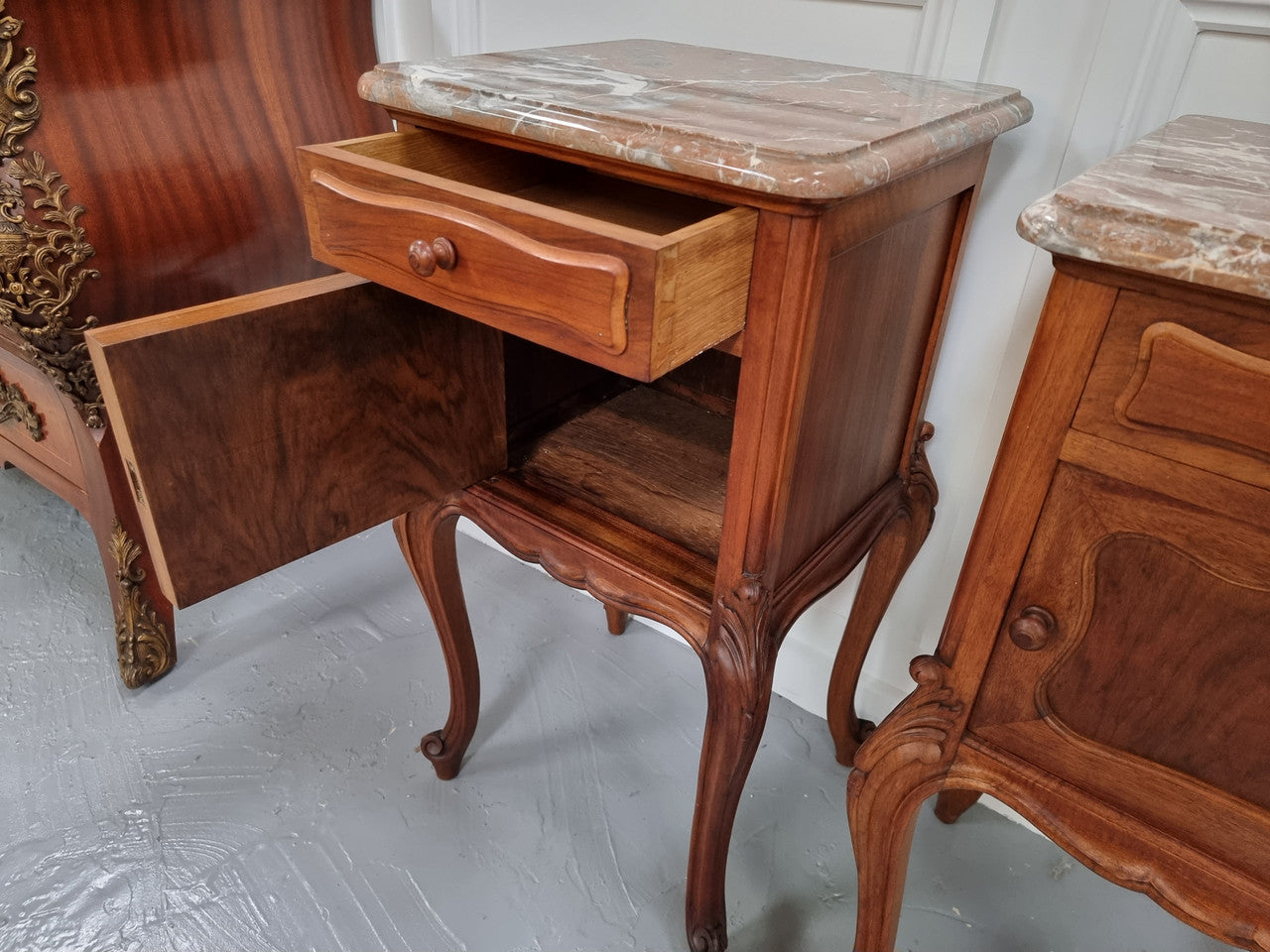 French Louis XVI style figured Walnut marble top bedsides. In good original detailed condition.