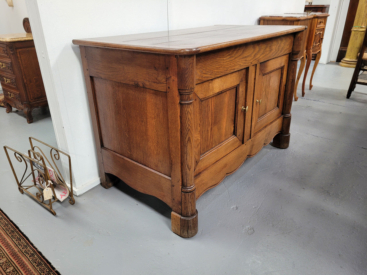 French 19th Century Oak dough bin buffet. The heavy solid top lifts upto reveal a half barrel compartment where traditionally flour and yeast were poured, mixed and proofed to grow into a nice dough.
Although originally intended for dough this would make an ideally TV cabinet with the two doors opening with plenty of storage.