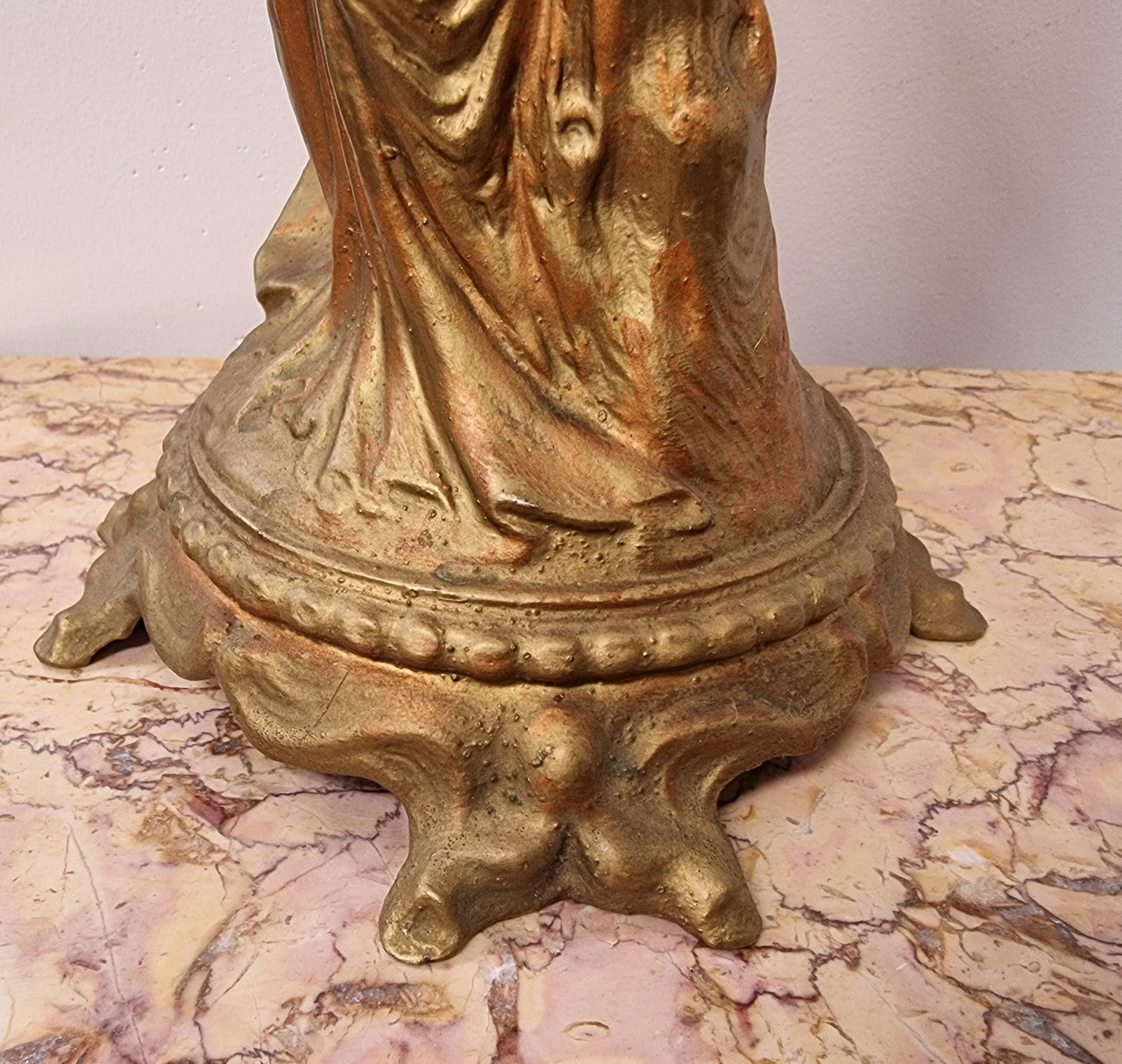 Late Victorian spelter table Centerpiece/comport featuring a woman holding an opalescent and ruby glass bowl. In good original condition with no damage to the ruby bowl.