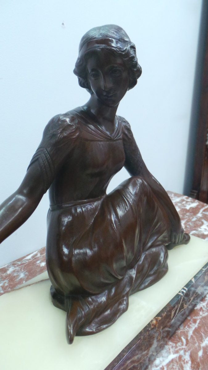 An Art Deco bronze statue with brown patina, of a lady and parrot on a marble base. Signed by Italian Sculptor A Trefoloni, an important and highly regarded sculptor. The statue is in very good condition.