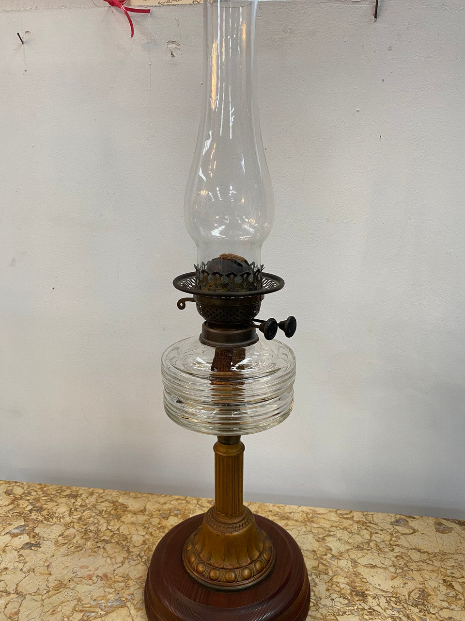 Edwardian ribbed glass kero lamp on a turned wooden base. Circa 1900's.