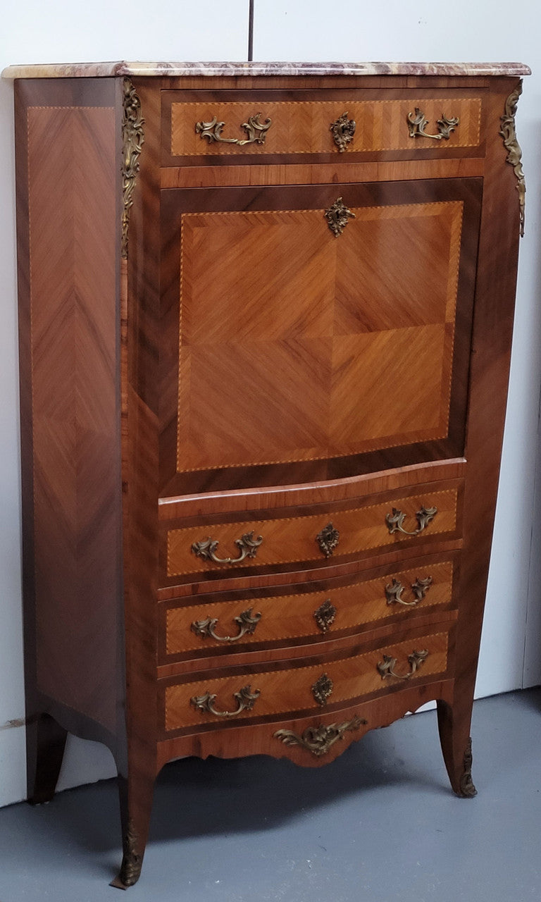 Walnut Louis XV style marble top abbattant with beautiful parquetry inlay and ormolu mounts. It has plenty of storage space with four large drawers and four smaller internal drawers. Beautiful drop down desk with a leather insert. In very good original detailed condition.