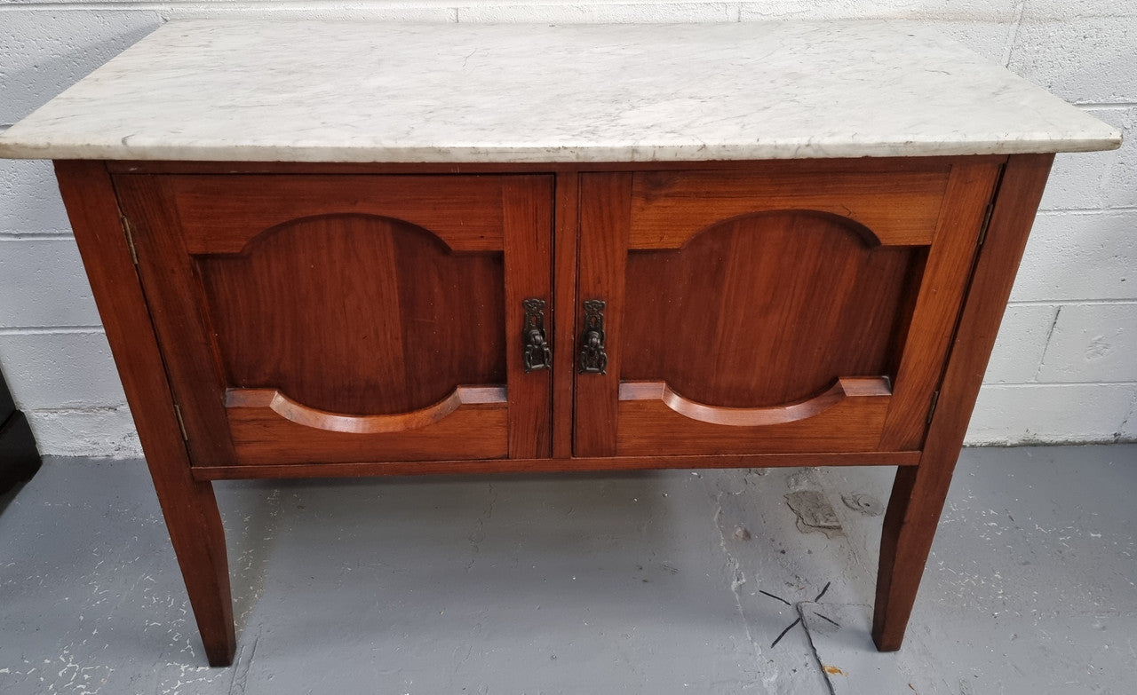 Blackwood two door white marble top cabinet. This would be ideal to be used as an entertainment unit, a TV stand or TV cabinet. In good original condition.