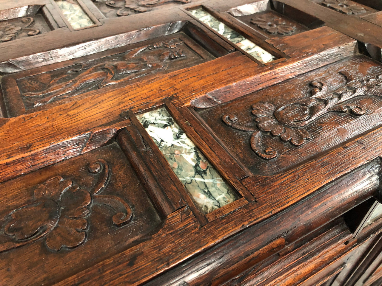 A unique 18th century French oak carved cabinet with inset marble. In good original condition.