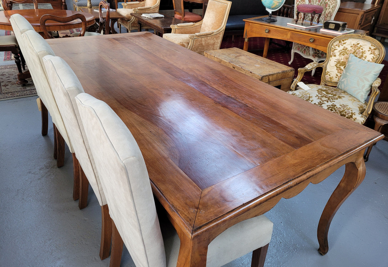 An amazing Vintage Cherry Wood dining table. Comfortably seats eight people and is in good original detailed condition.