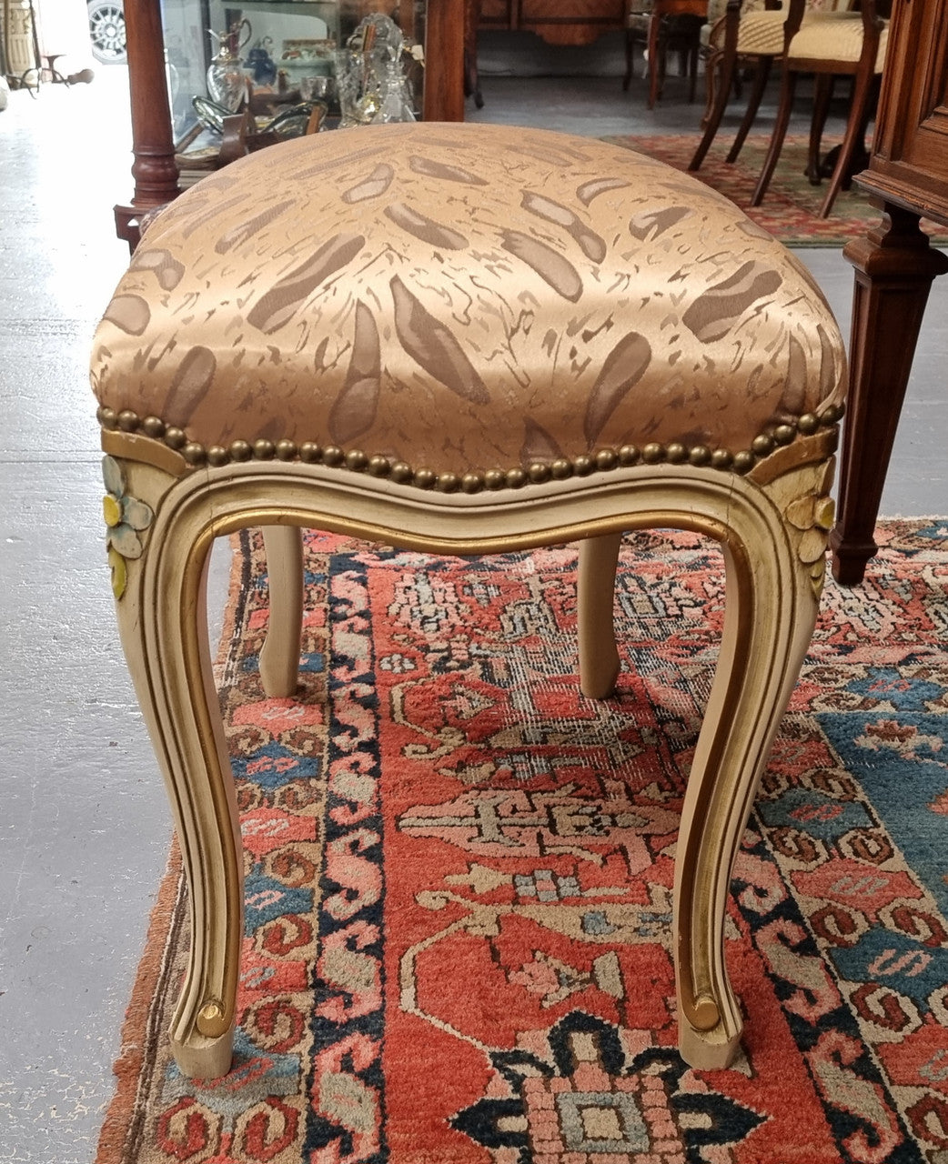 Appealing French Louis 15th style hand painted and gilded stool with good upholstery. In good original detailed condition.