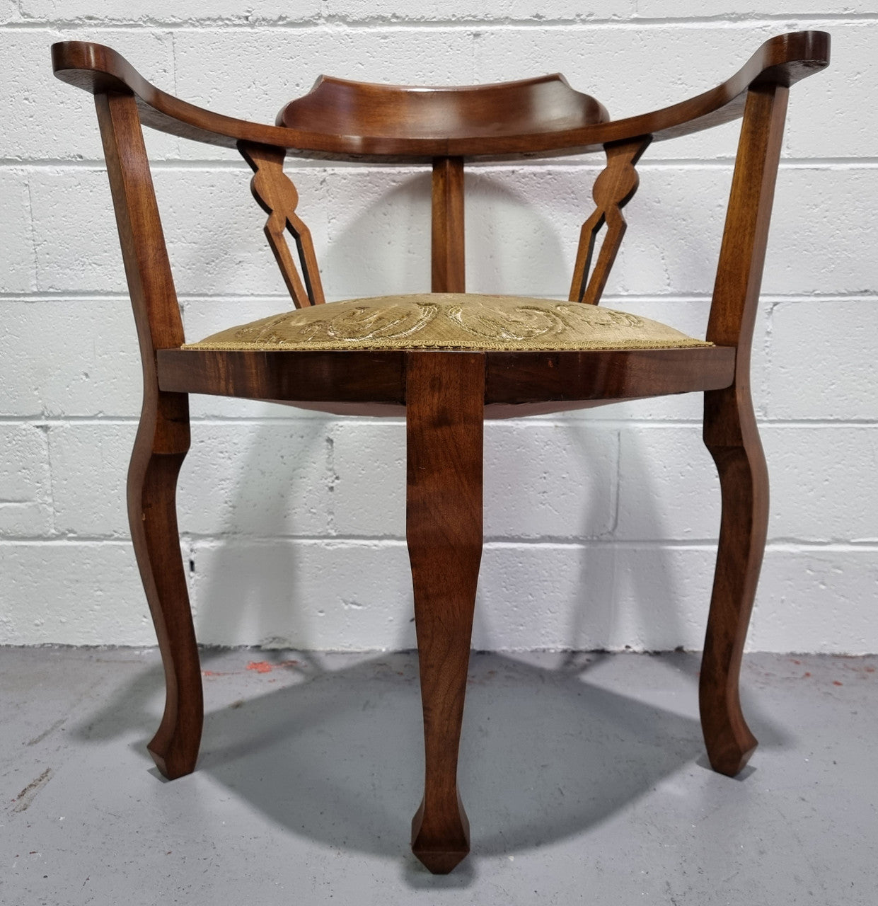 Mahogany upsholstered corner chair. It is in good original condition with clean upholstery.