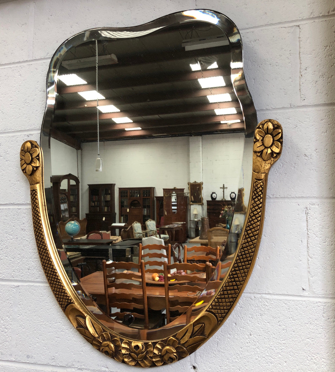 Beautiful French decorative Art Deco giltwood wall mirror with lovely floral detail. Contains its original mirror and is in good original condition.