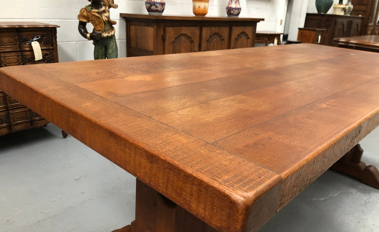 Lovely Oak French Farmhouse table with a thick plank top and lovely stretcher base. Can comfortable seat 8-10 people and is in good original detailed condition.