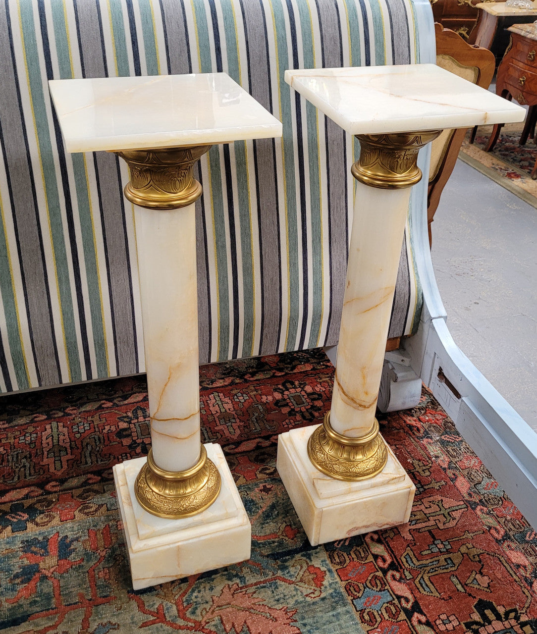 Pair of Imposing French alabaster marble and bronze pedestals. They are highly decorative and have been sourced from France. They are in good original detailed condition.