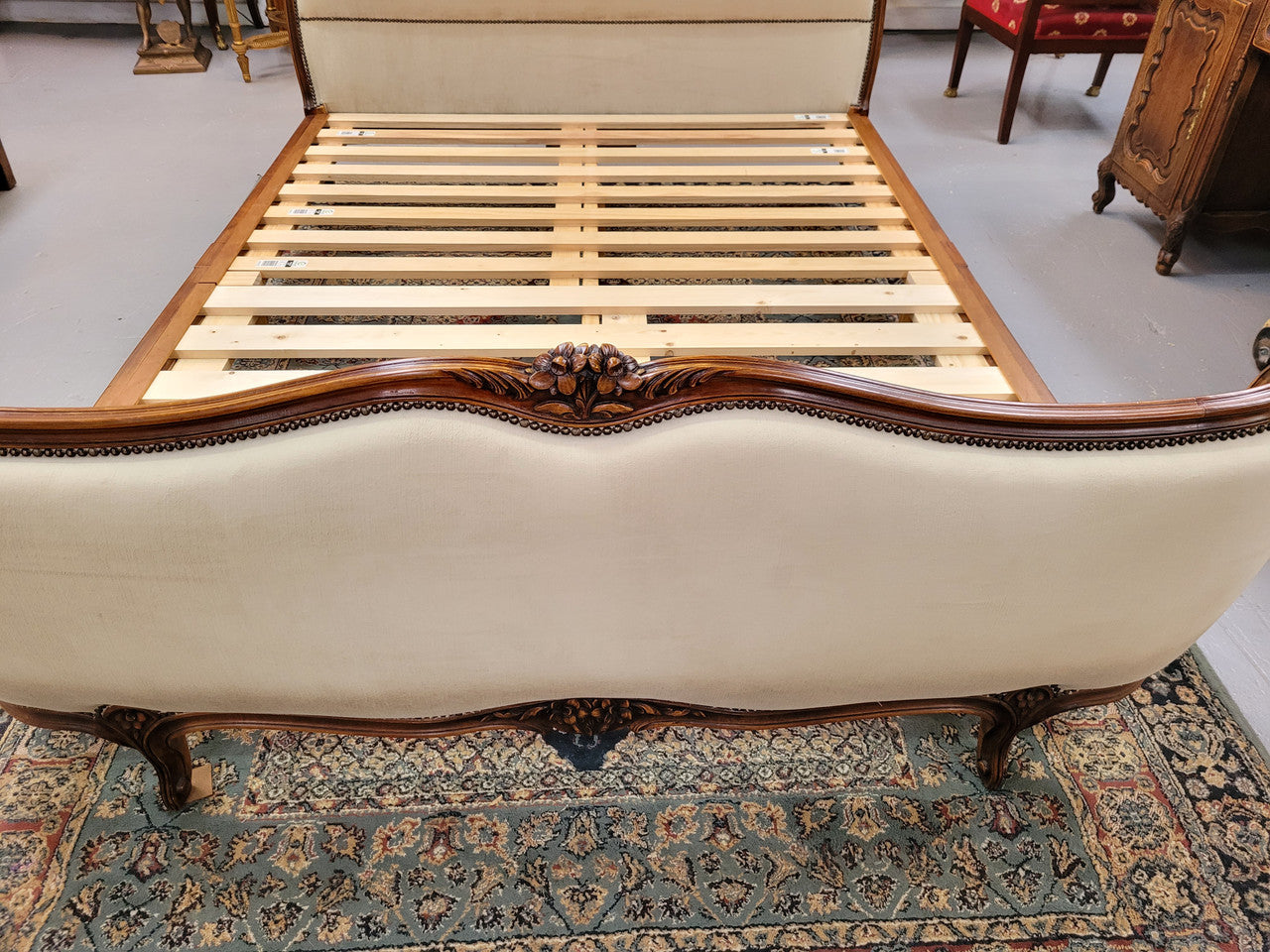 French Louis XV style queen size upholstered bed. Upholstery is in good condition and bed is complete with custom made slats. Just place your mattress on top.