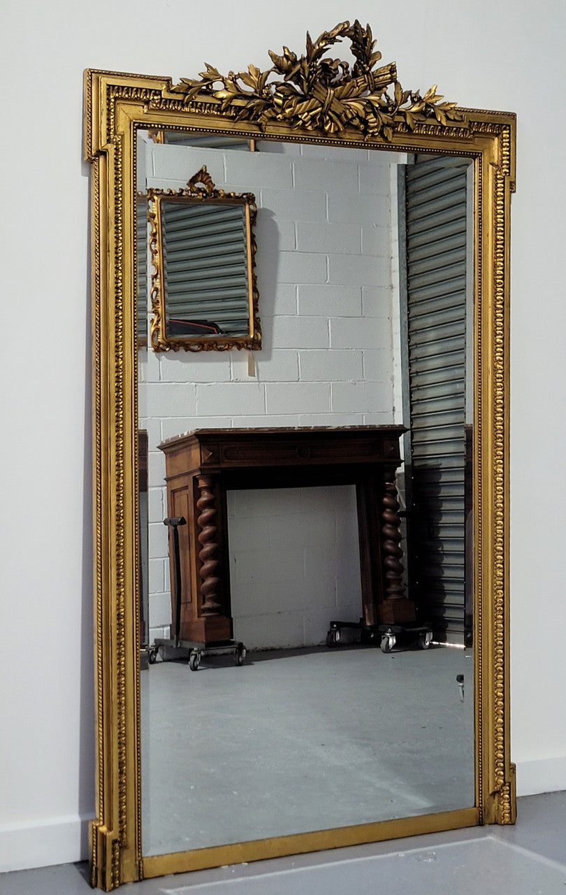Substantial Louis XI style French Antique over mantel mirror. It is in very good restored condition.