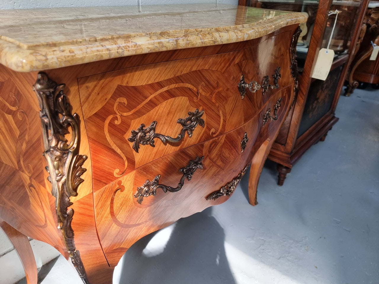 French marquetry inlaid Kingwood marble top commode. It has two drawers and beautiful mounts. Is in good original detailed condition.