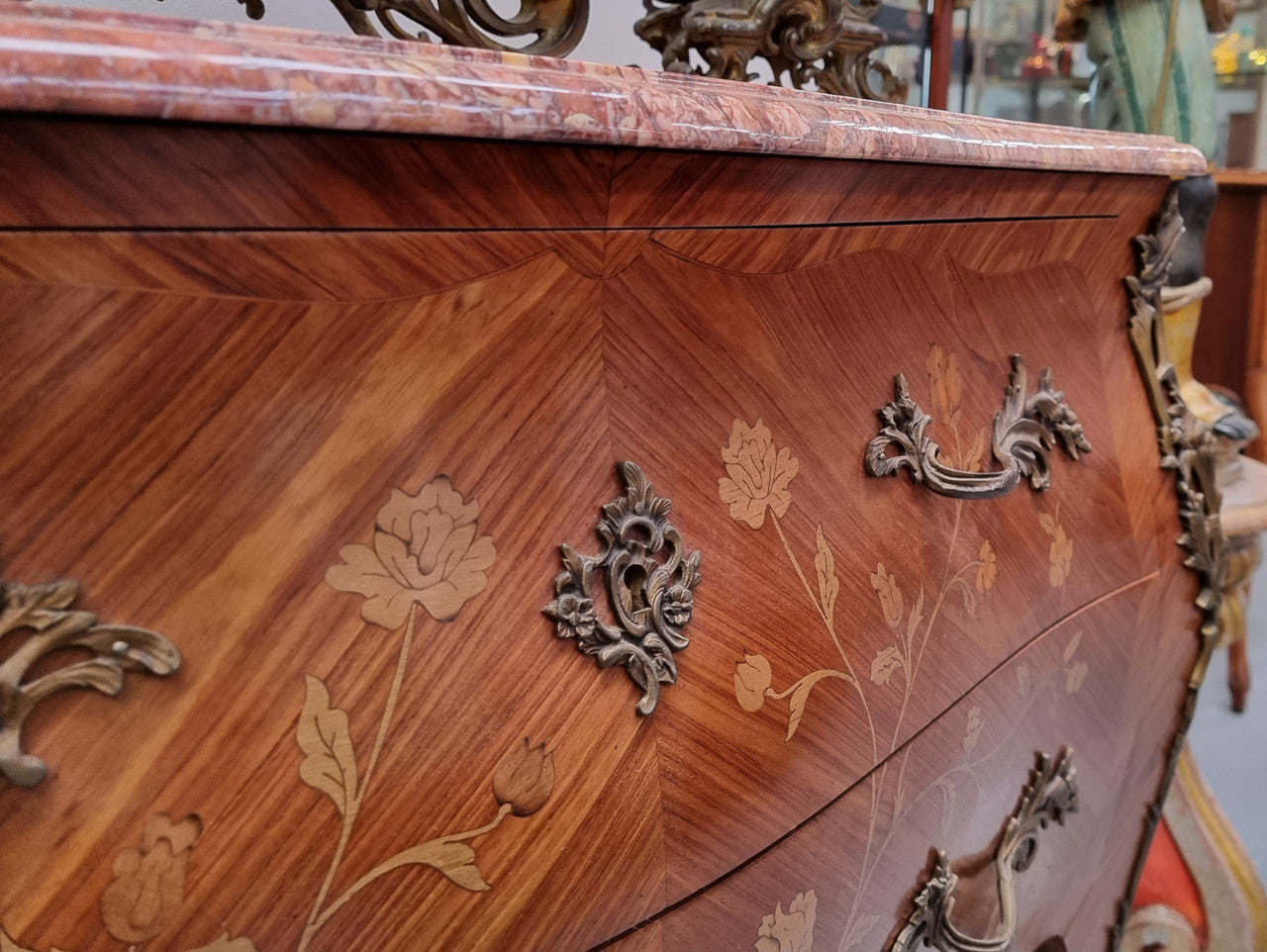 Stunning Louis XV style marquetry inlay marble top two drawer commode. It has decorative ormolu mounts and beautiful marble top. In good original detailed condition.