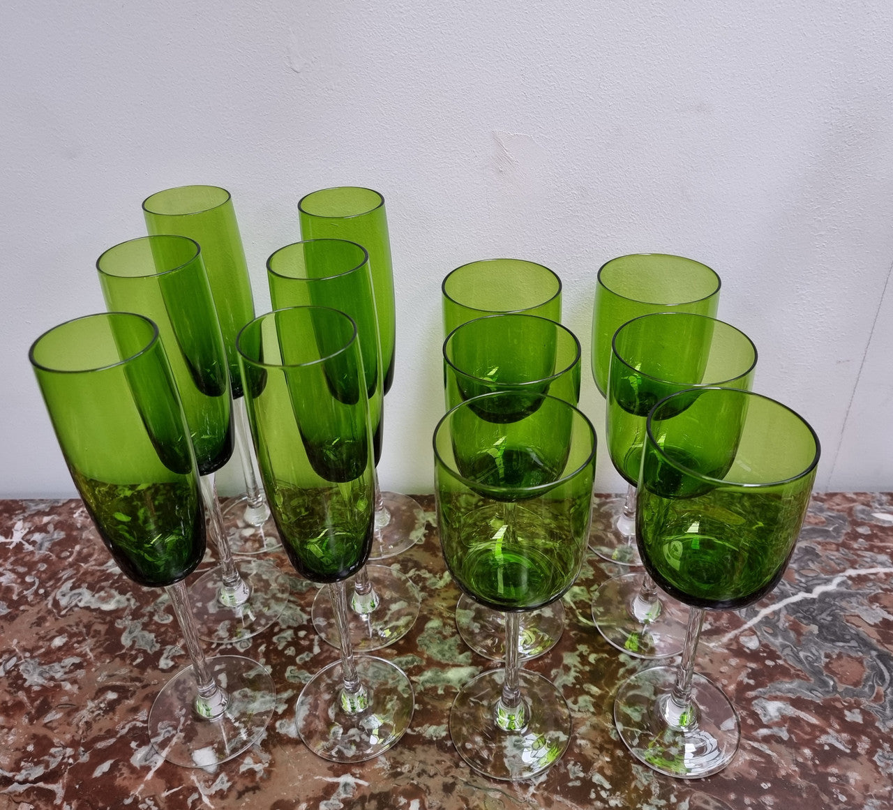 Beautiful set of 12 Vintage emerald green hand made wine glasses. Possibly Italian or French. They are in good original condition with no chips or cracks.