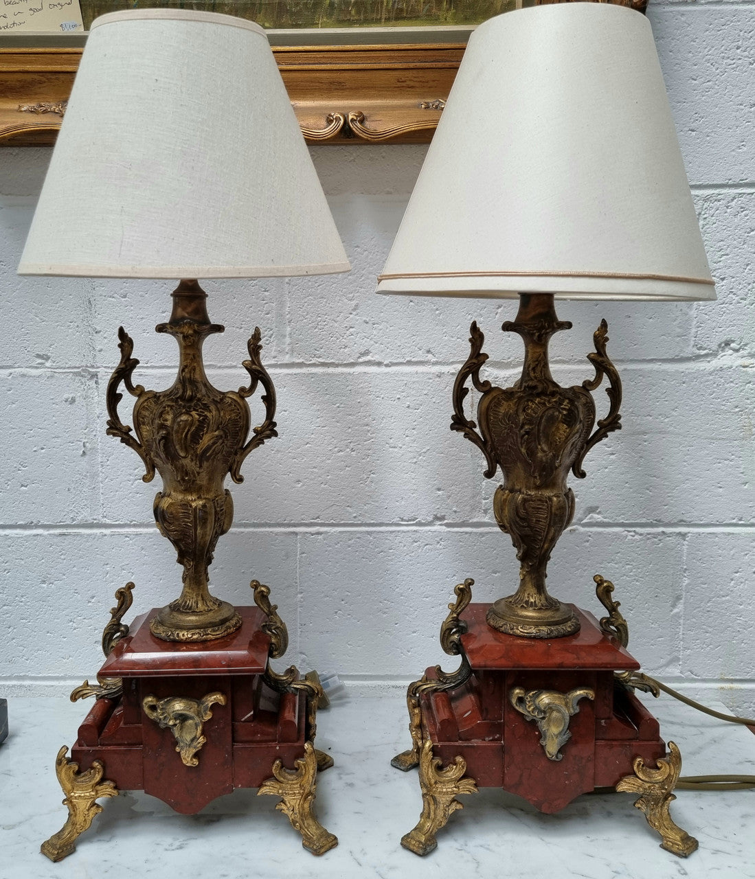 Pair of decorative French Louis XV style marble and gilt metal lamps with shades. In good original detailed working condition.