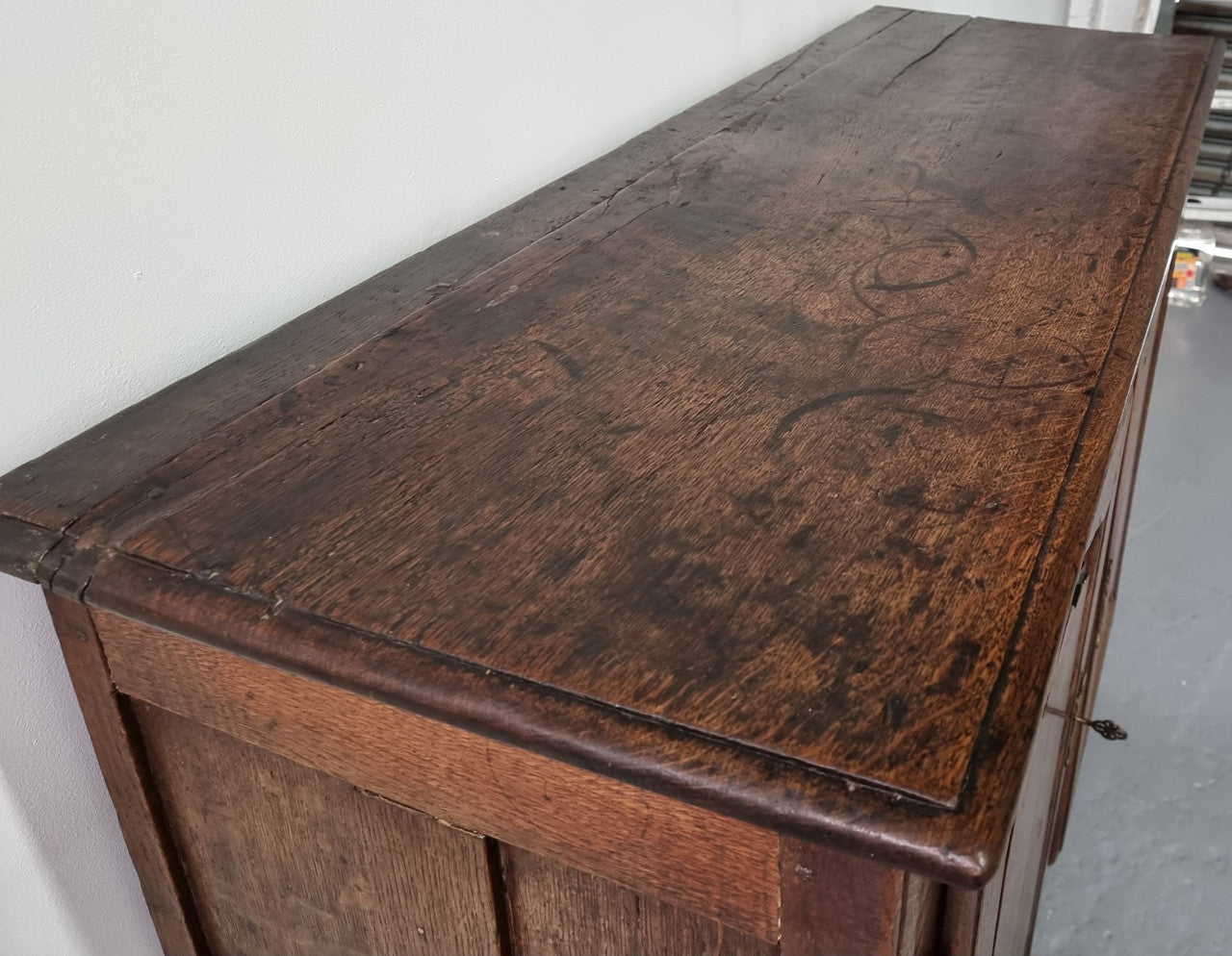 A charming French Oak early 18th Century two door sideboard. Plenty of storage space with two fixed shelves either side. It is in good original detailed condition for its age and comes with a working key and working locks.