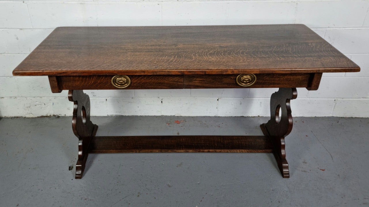 French dark Oak two drawer console table. It has loads of character and is in good original detailed condition.