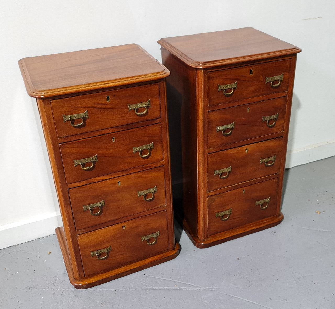 Pair of English Victorian Mahogany bedside drawers. In good original detailed condition.
