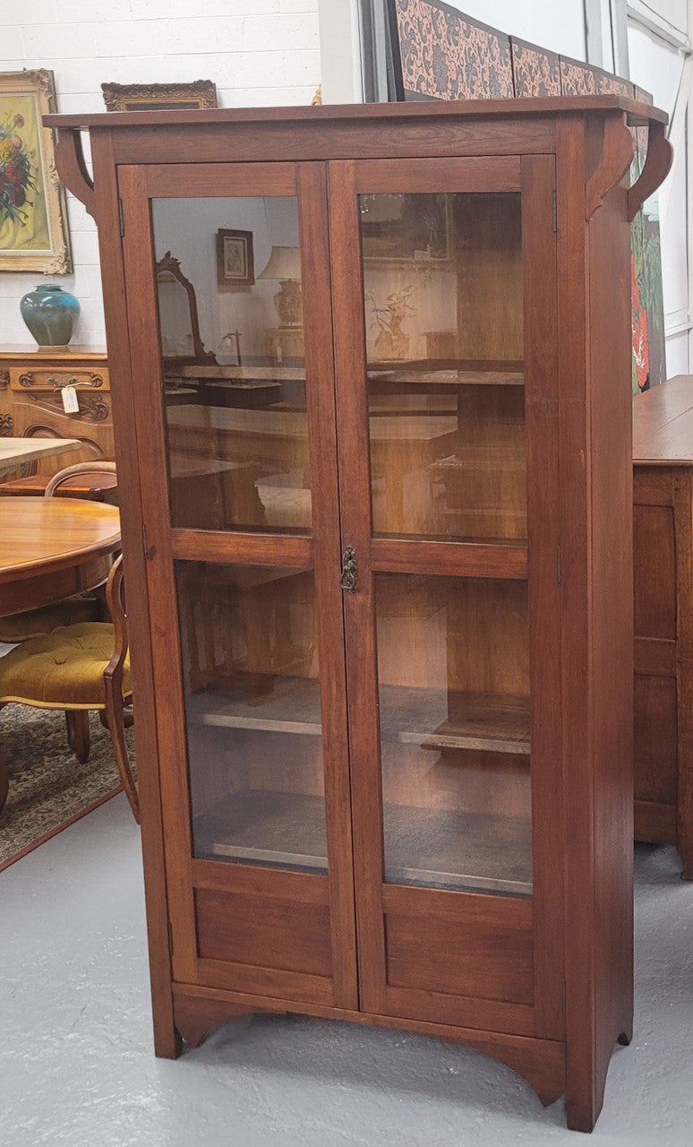 Beautiful two door Blackwood bookcase with glass doors and with four fully adjustable shelves. It is in good original detailed condition.