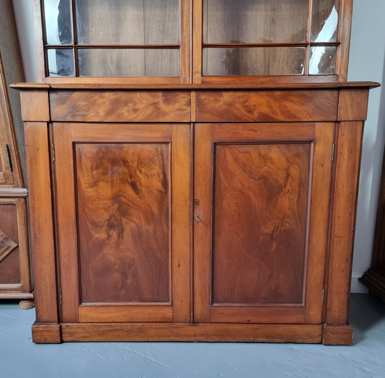 Rare early Australian colonial full Cedar bookcase. Plenty of storage underneath and glass top doors open up too three fully adjustable shelves. In good restored condition.