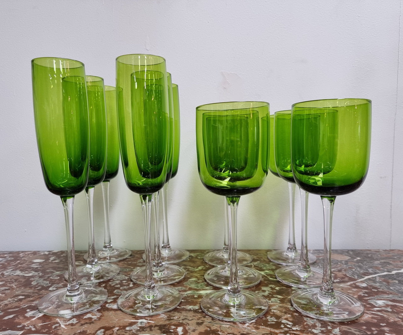 Beautiful set of 12 Vintage emerald green hand made wine glasses. Possibly Italian or French. They are in good original condition with no chips or cracks.