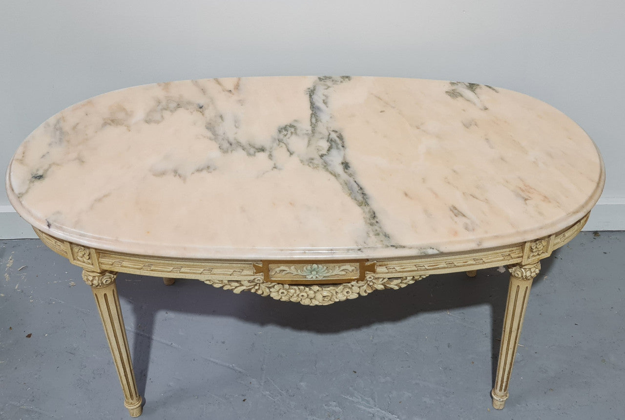 Charming painted Louis XVI style oval marble top coffee table. In good original detailed condition.
