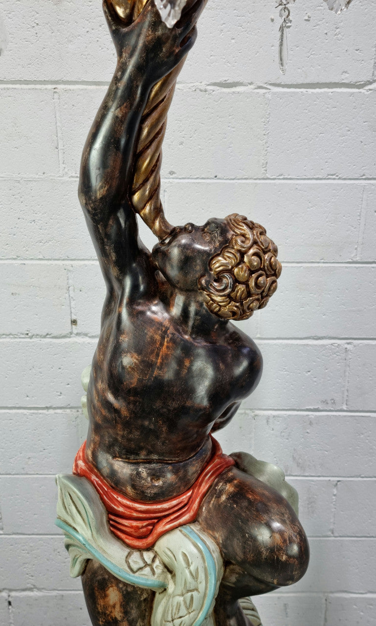19th Century Italian Wooden Blackamoor lamp sourced in France. Made from carved wood painted & gilded. Amazing detail of a man playing a horn that then turns into a chandelier while riding a mythological sea serpent It has been fully rewired to Australian standards.