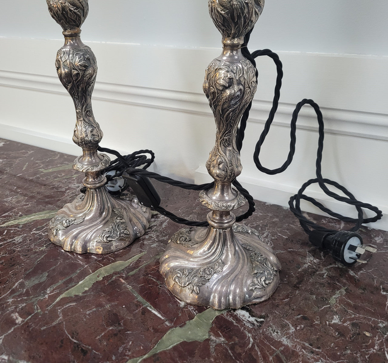 Pair of Antique French Silver candlestick table lamps with new wiring. In good original condition.