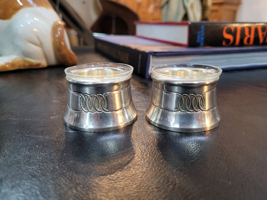 Pair antique silver salt cellars with liners. Stamped “800” 80g. 4.5cm Diam & 3cm Height. In good condition please view photos as they help form part of the description.