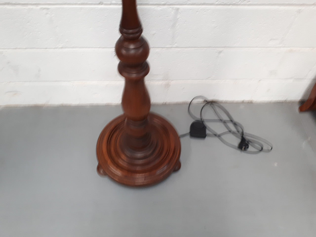 Antique Walnut standard lamp, with foot switch and in good working order condition.