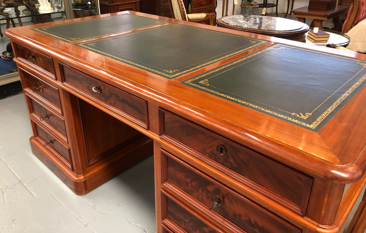 Antique French Mahogany and leather inset top double pedestal partners desk. Plenty of storage space with 9 long drawers on one side and space for someone to sit on the other side. In good restored condition. Circa 1880's.