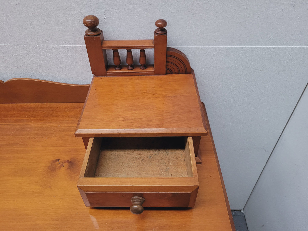 Late Victorian Huon Pine desk with two drawers. Featuring superb birdseye panels and is in good original detailed condition.