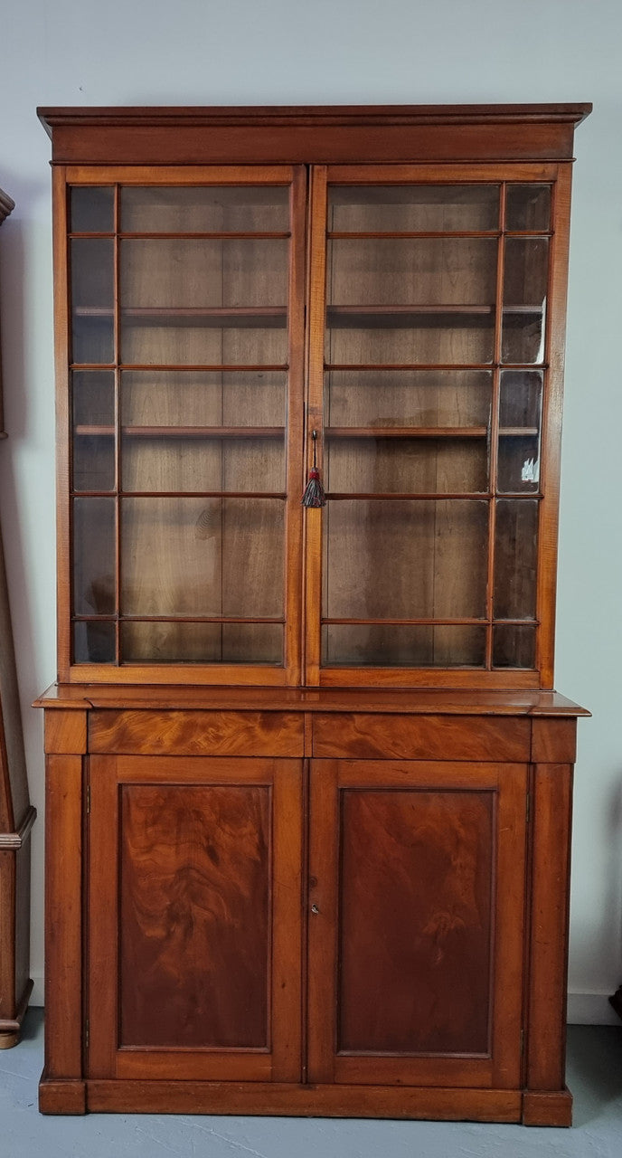 Rare early Australian colonial full Cedar bookcase. Plenty of storage underneath and glass top doors open up too three fully adjustable shelves. In good restored condition.