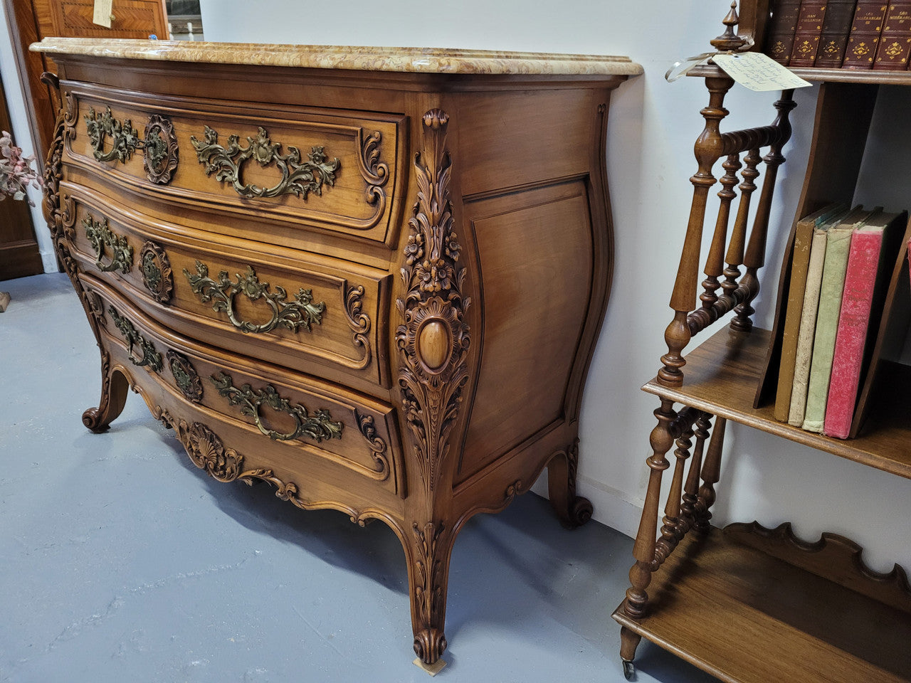Impressive Louis XV style three drawer walnut commode. Ormolu handles and bevelled marble top complimenting detailed carving. In very good original detailed condition.
