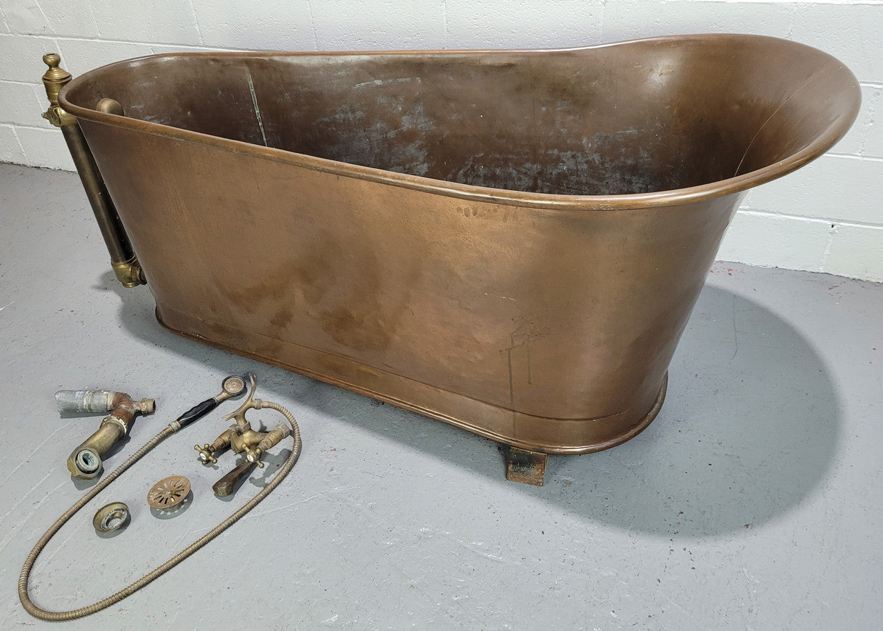 Sourced from France a rare full copper Antique bath tub on feet and includes an overflow, fittings, taps ect. In good original condition.