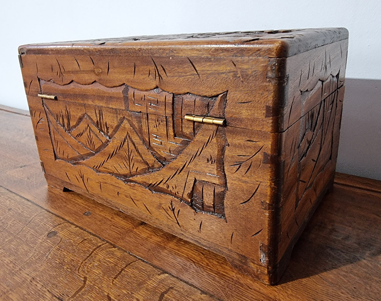 Small Chinese carved camphor wood jewellery box. It is in original condition.
