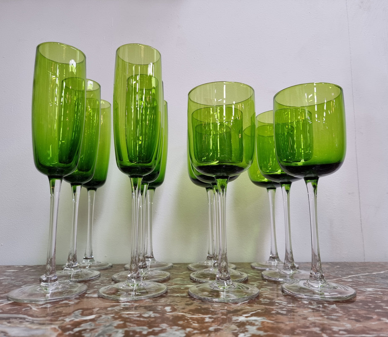 Beautiful set of 12 Vintage emerald green hand made wine glasses. Possibly Italian or French. They are in good original condition with no chips or cracks.