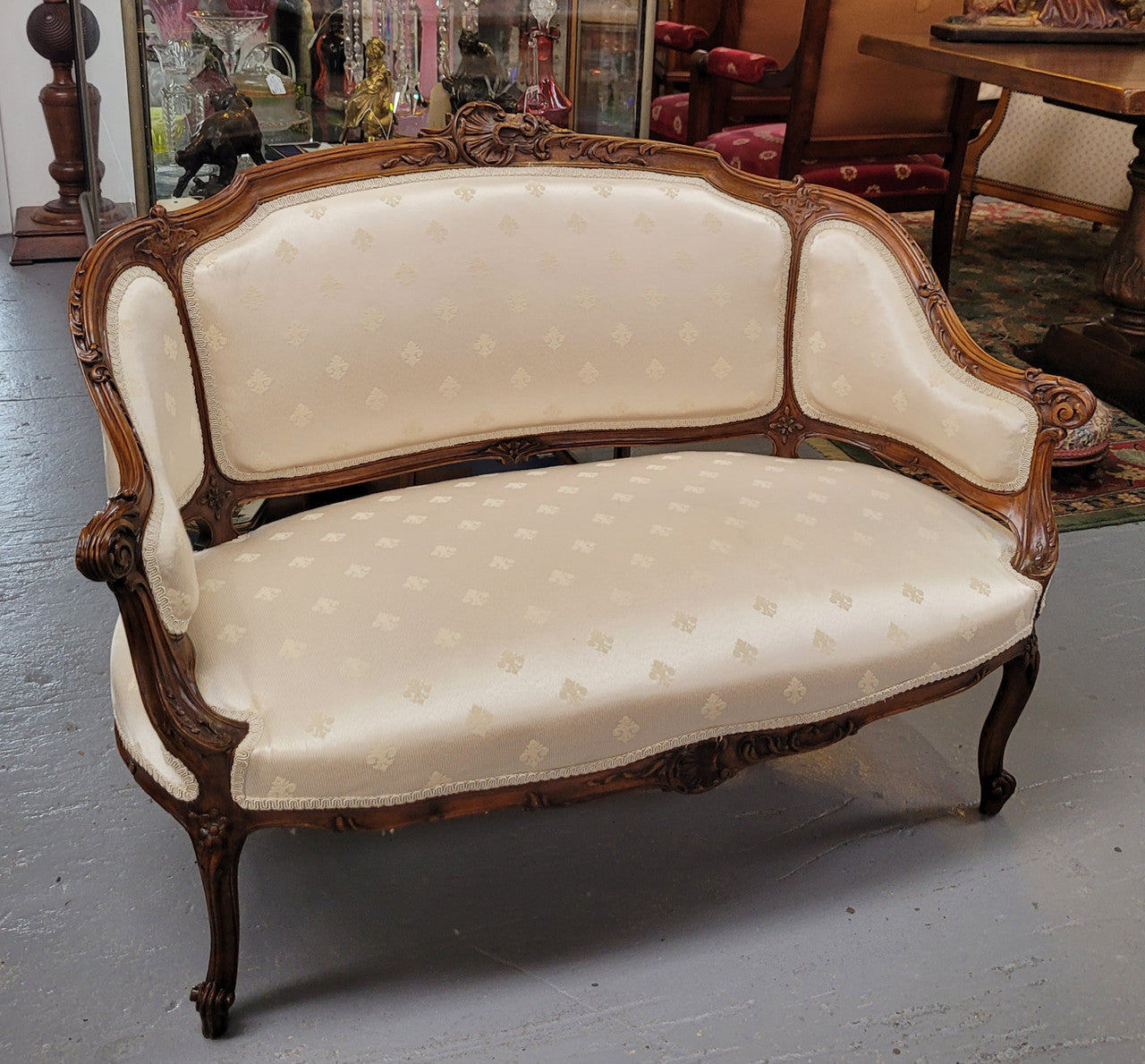 Pretty French Louis XV style small Walnut settee with very good upholstery. Sourced from France and in good original condition, please view photos of the upholstery as it helps form part of the description.