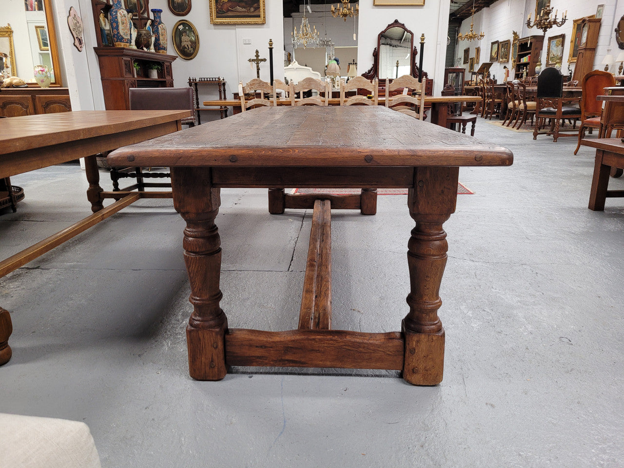 Amazing 2.65 meter French Elm Refectory dining table with loads of rustic charm. This table has been sourced from France and can comfortably seat ten people. It is in good original detailed condition.